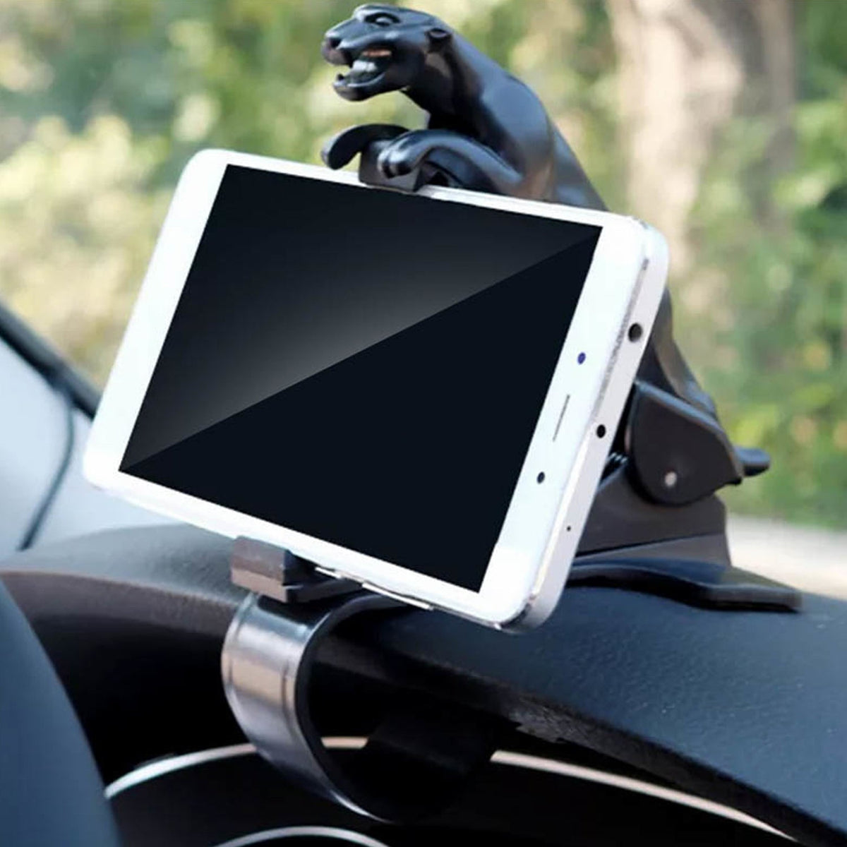 PHOBIA leopard car phone holder securely gripping a smartphone on a car dashboard. Main image