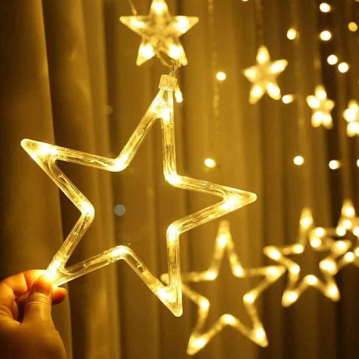A cluster of glowing Star Curtain Lights creating a festive window display. Main image