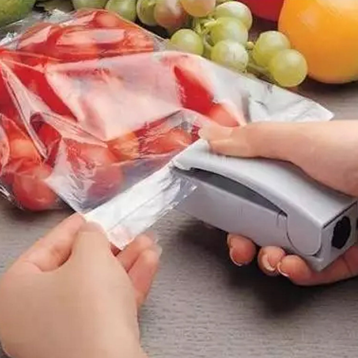 Mini portable plastic bag sealer efficiently seals food packets for freshness. Main image