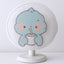 Cartoon fabric mesh fan cover fitted on a pedestal fan