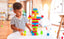 Colorful plastic building blocks for kids in a gift-ready bag, promoting creative play.