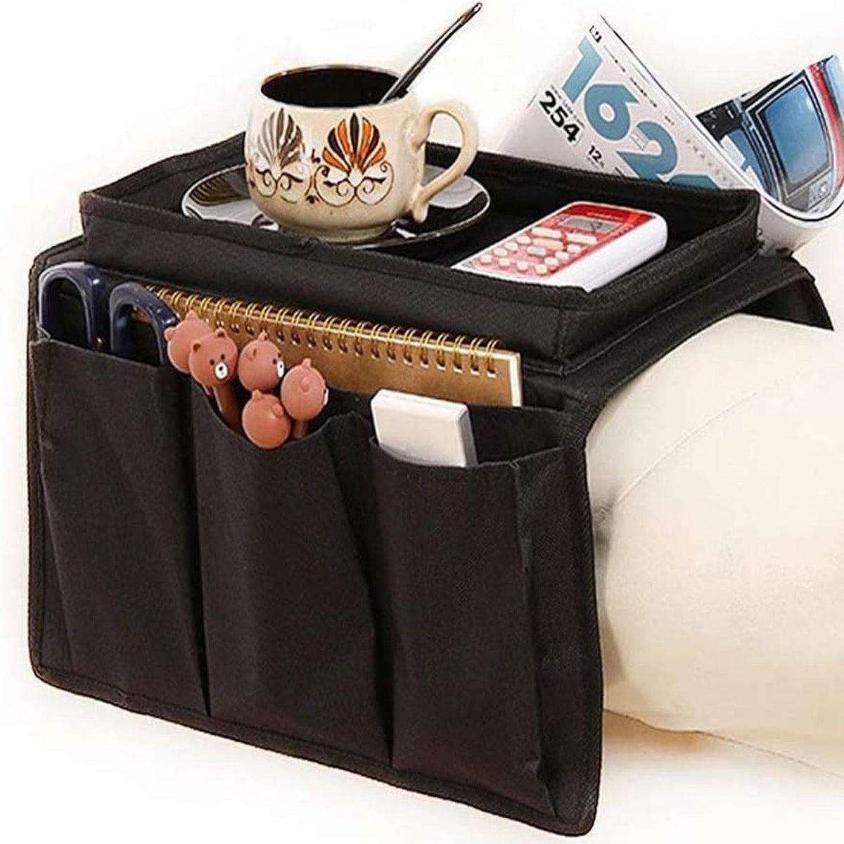 Black sofa armrest organizer with a sturdy tray and multiple pockets. Main image