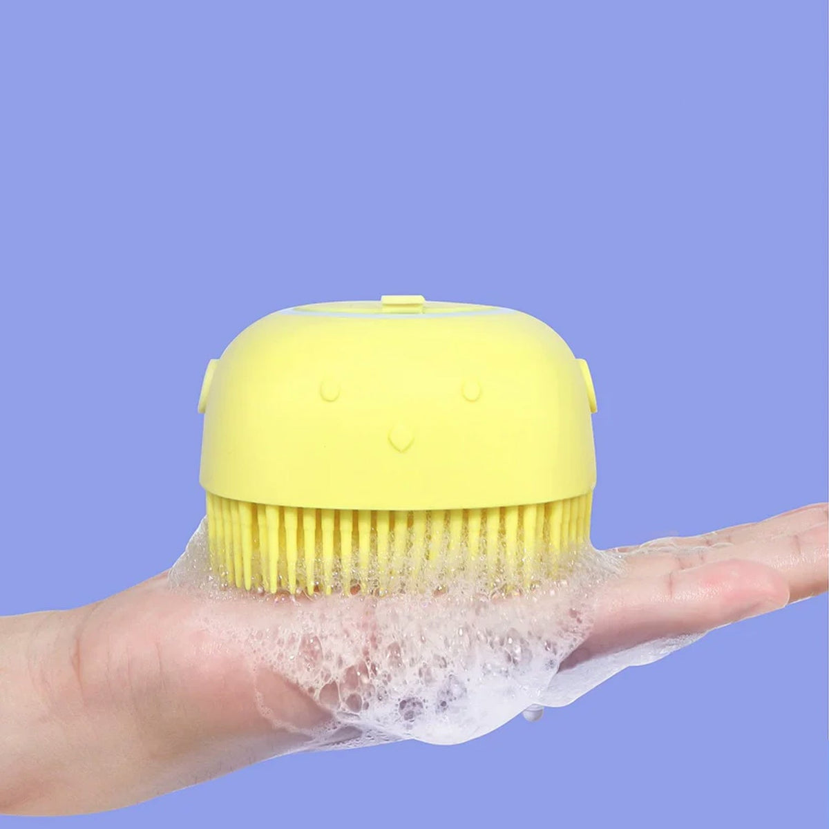 Front view of a soft silicone bath brush with integrated shampoo dispenser. Main image