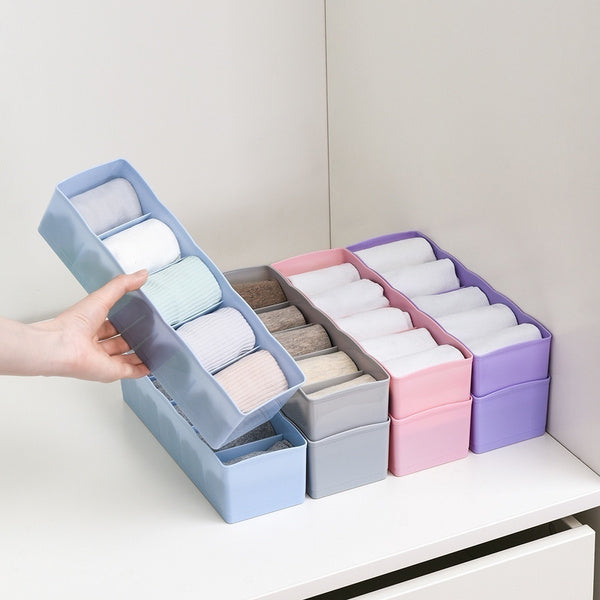 Clear plastic organizer tray with multiple compartments for beads and small craft items. Main image