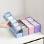 Clear plastic organizer tray with multiple compartments for beads and small craft items.
