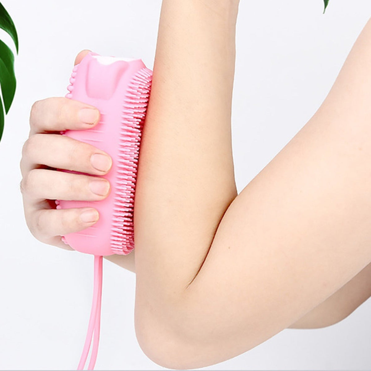 Soft silicone body scrubber in a bubble bath, showing its gentle bristles. Main image