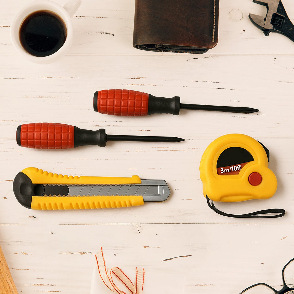 Compact 4 in 1 hand tool kit with tape measure, screwdriver and cutter for home repairs Main image