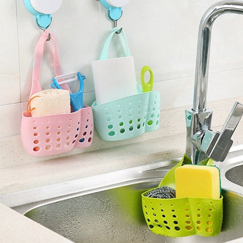 Adjustable plastic faucet sink caddy in a modern kitchen. Main image
