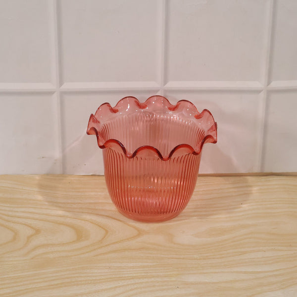 Daily use decorative flower pot displayed on a shelf