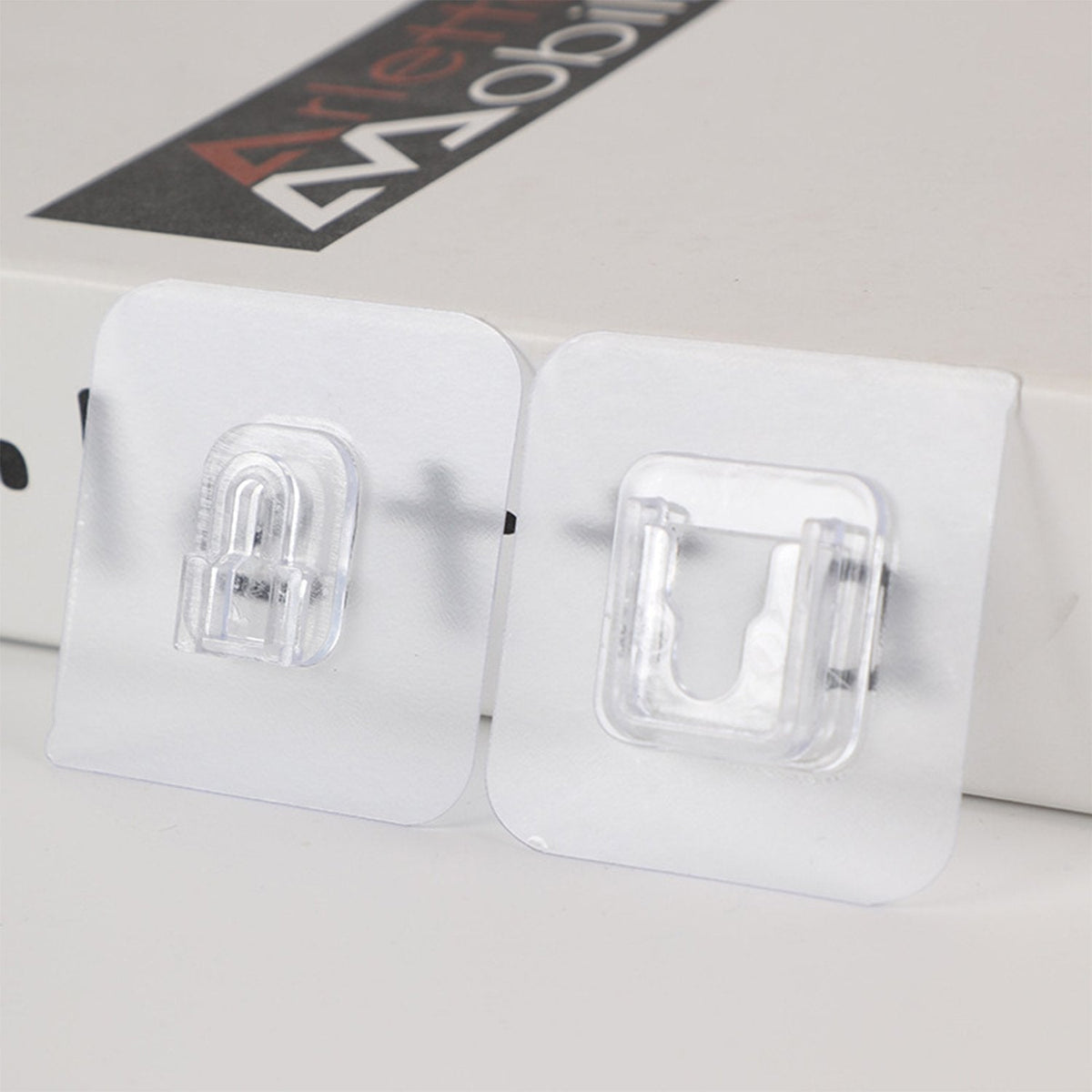 A pack of 20 GlimmerHome heavy-duty adhesive wall hooks shown for drill-free home organization. Main image