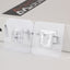 A pack of 20 GlimmerHome heavy-duty adhesive wall hooks shown for drill-free home organization.