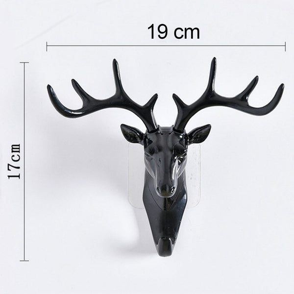 Stylish deer head hook in grey, functioning as a decorative hanger for a hat.
