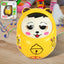 Multicolor musical roly poly toy with a cute animal face