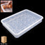 Two clear plastic egg storage containers stacked inside a refrigerator