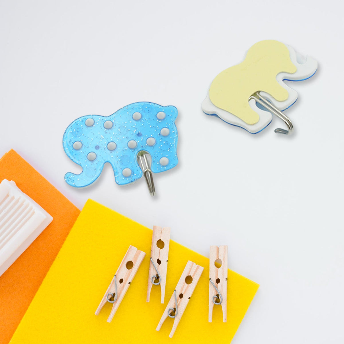 White self-adhesive hook on a tiled bathroom wall, demonstrating strong grip. Main image