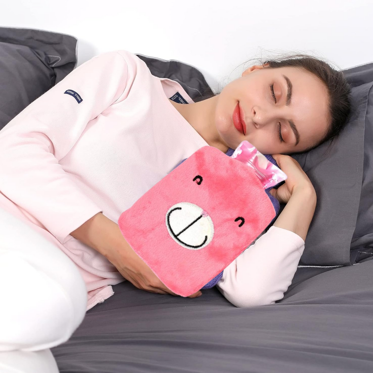 Pink Hot Water Bag with a soft cover, shown from the front. Main image