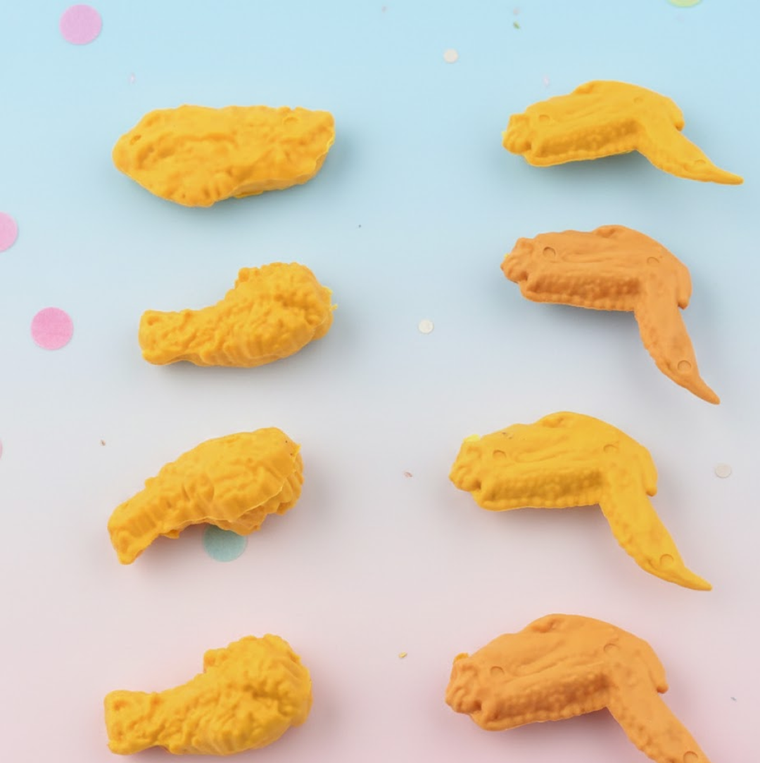 An 8-piece set of fun chicken erasers, featuring both chicken wing and leg shapes, displayed neatly. Main image