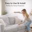 Person covering a beige sofa with a clear disposable furniture cover.