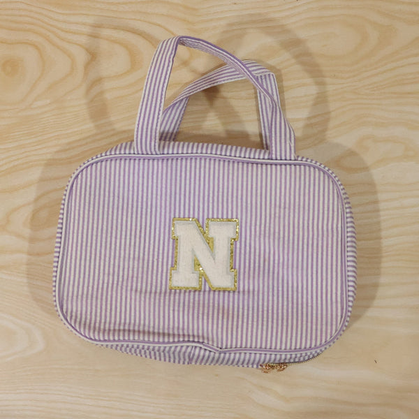 Detailed view of multi-pocket toiletry pouch with compartments