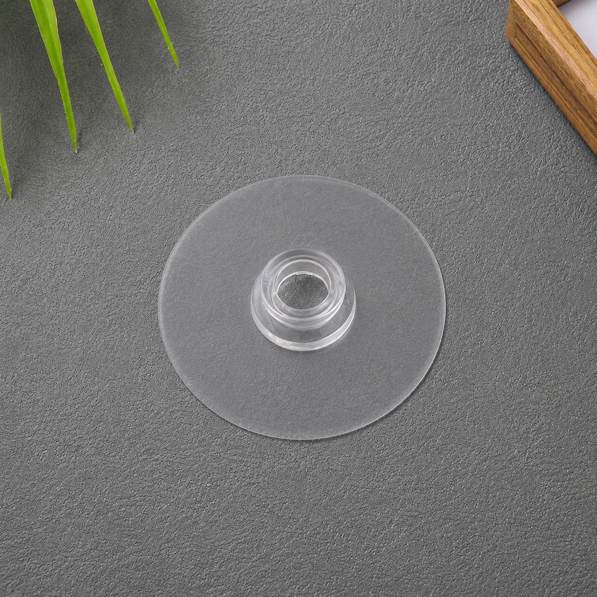 Transparent self-adhesive wall hook demonstrating strong hold Main image