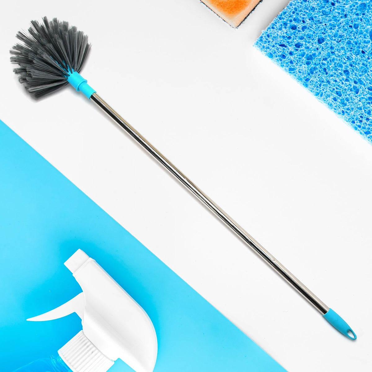Extendable cobweb cleaning brush with stainless steel handle reaching a high ceiling. Main image