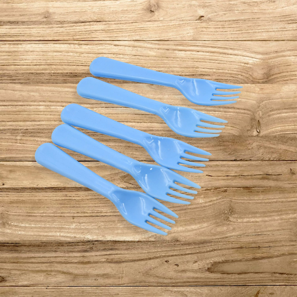 A neatly arranged set of five reusable plastic forks in a clean kitchen setting. Main image