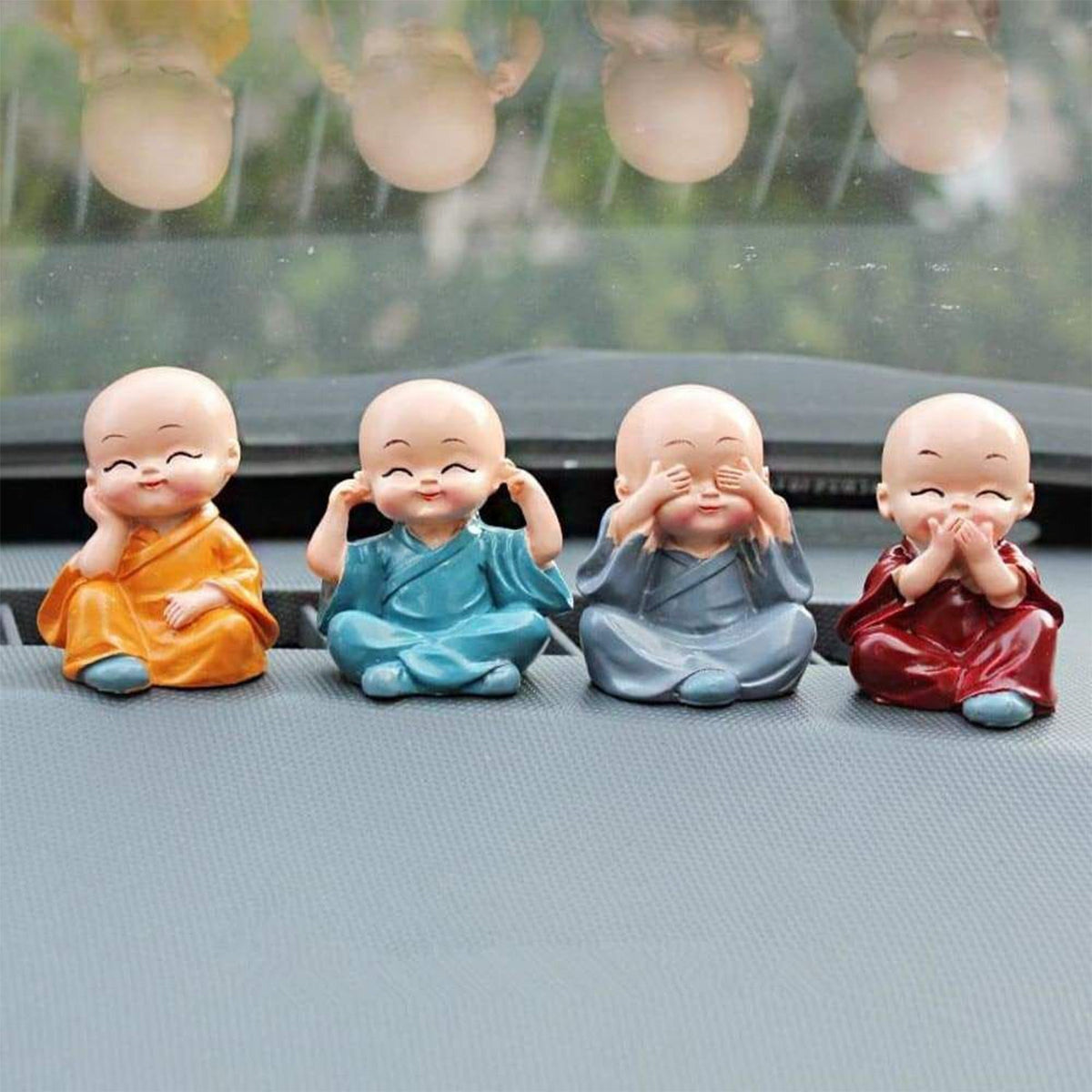 Adorable Baby Buddha showpiece set with four monk statues, perfect for home decor. Main image