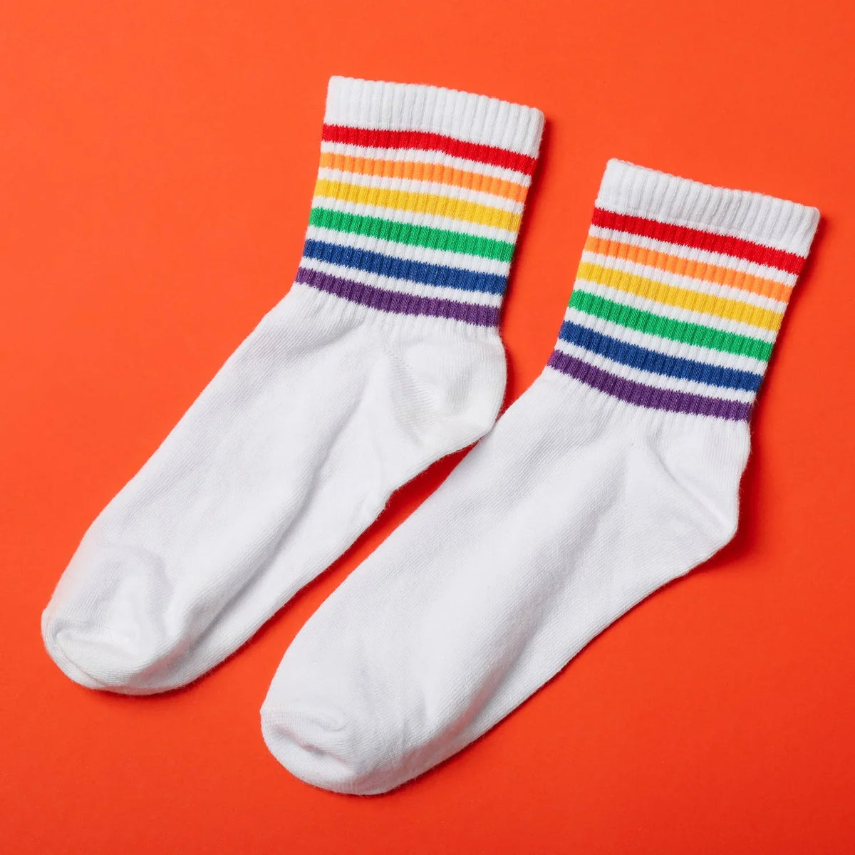 A vibrant assortment of Printed Designer Socks showcasing various patterns and colors. Main image