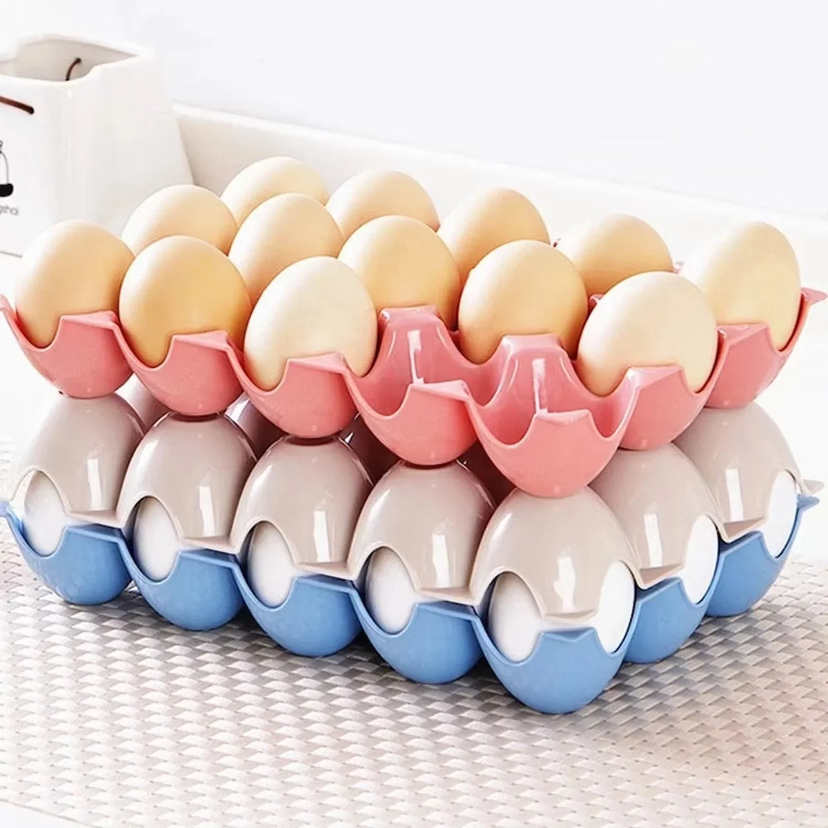 Set of four 15-cavity plastic egg trays for organised fridge storage. Main image