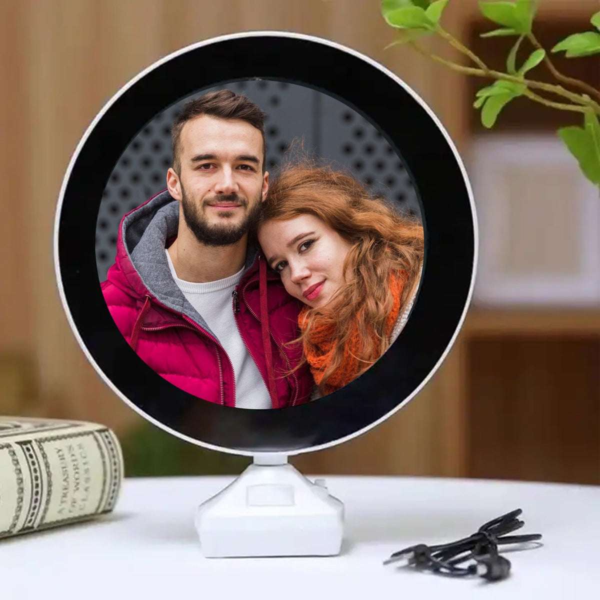 LED Magic Mirror Photo Frame glowing with a picture inside, on a white table. Main image