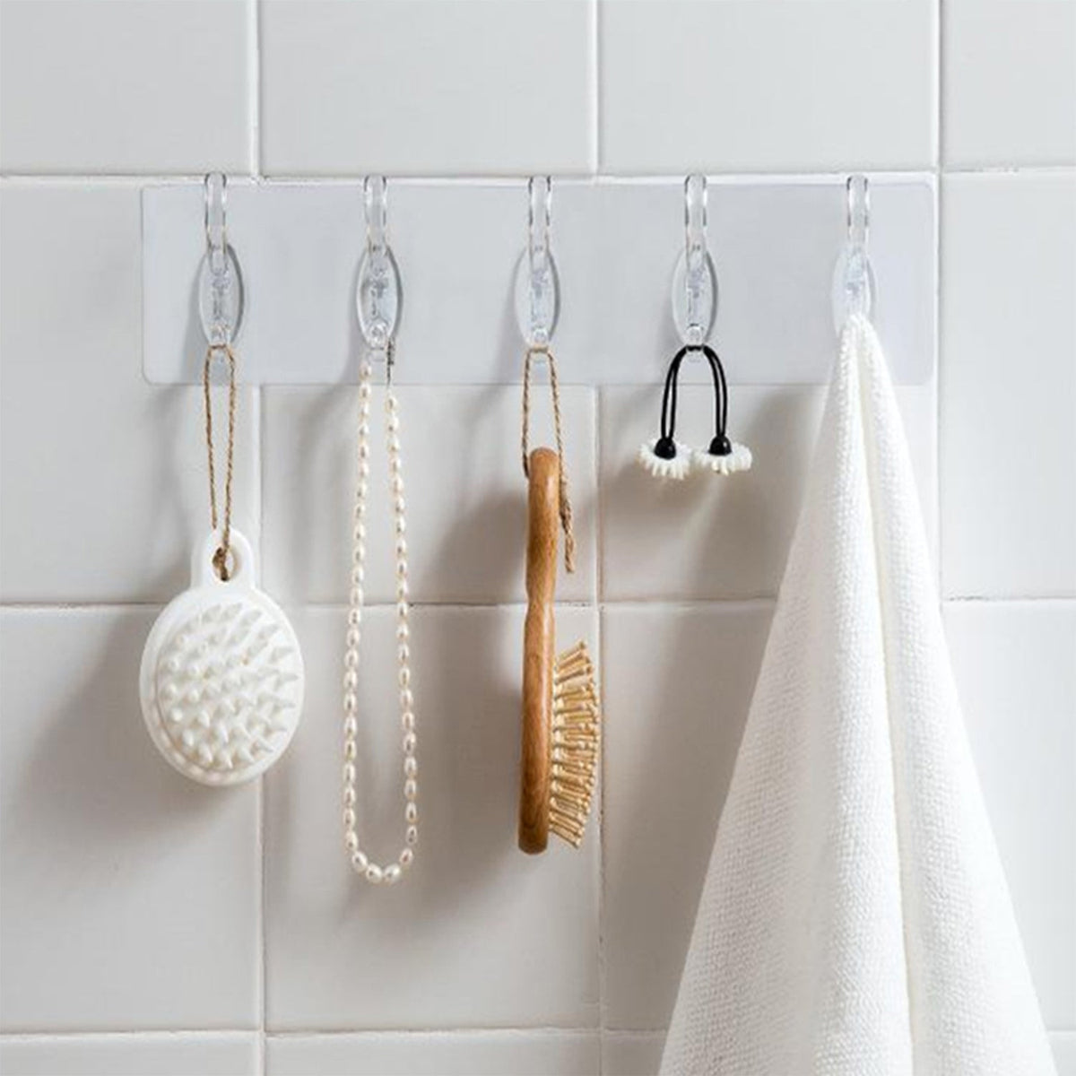 A pack of five transparent adhesive wall hooks from GlimmerHome, ready for damage-free hanging. Main image
