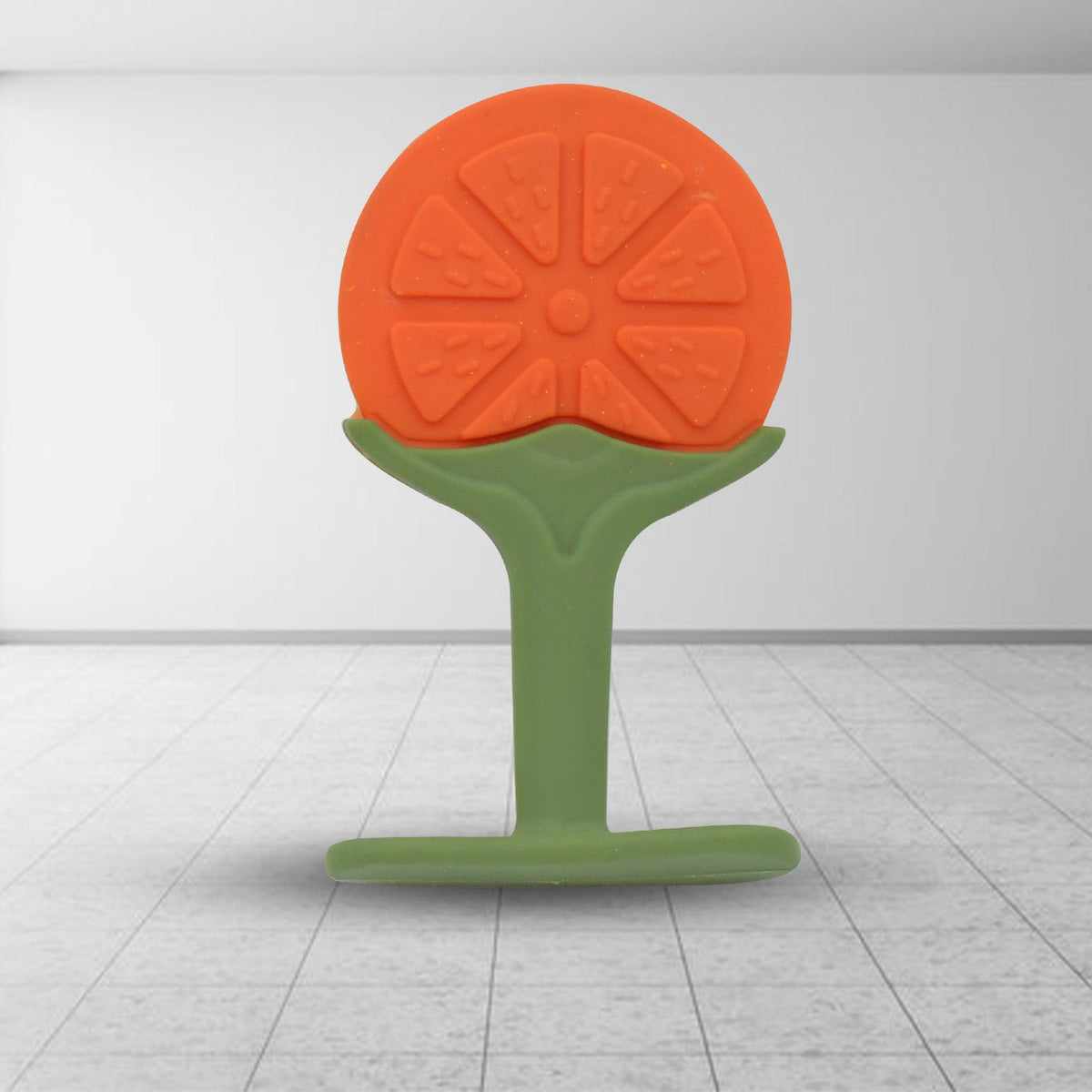 Close-up of a soft Baby Silicone Teether in a vibrant fruit shape. Main image