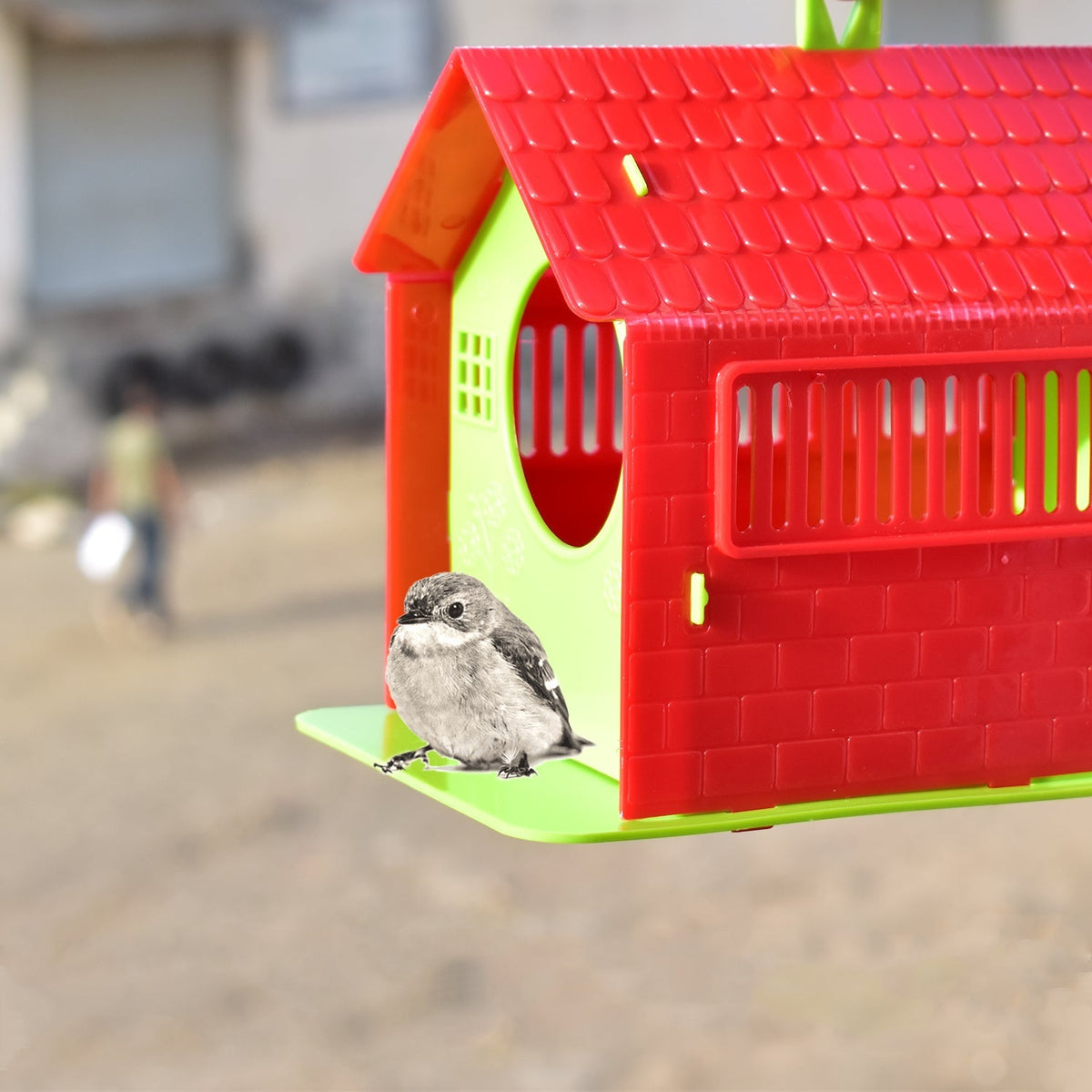 Front view of a rustic wooden bird house with a small entrance hole, perfect for small garden birds. Main image