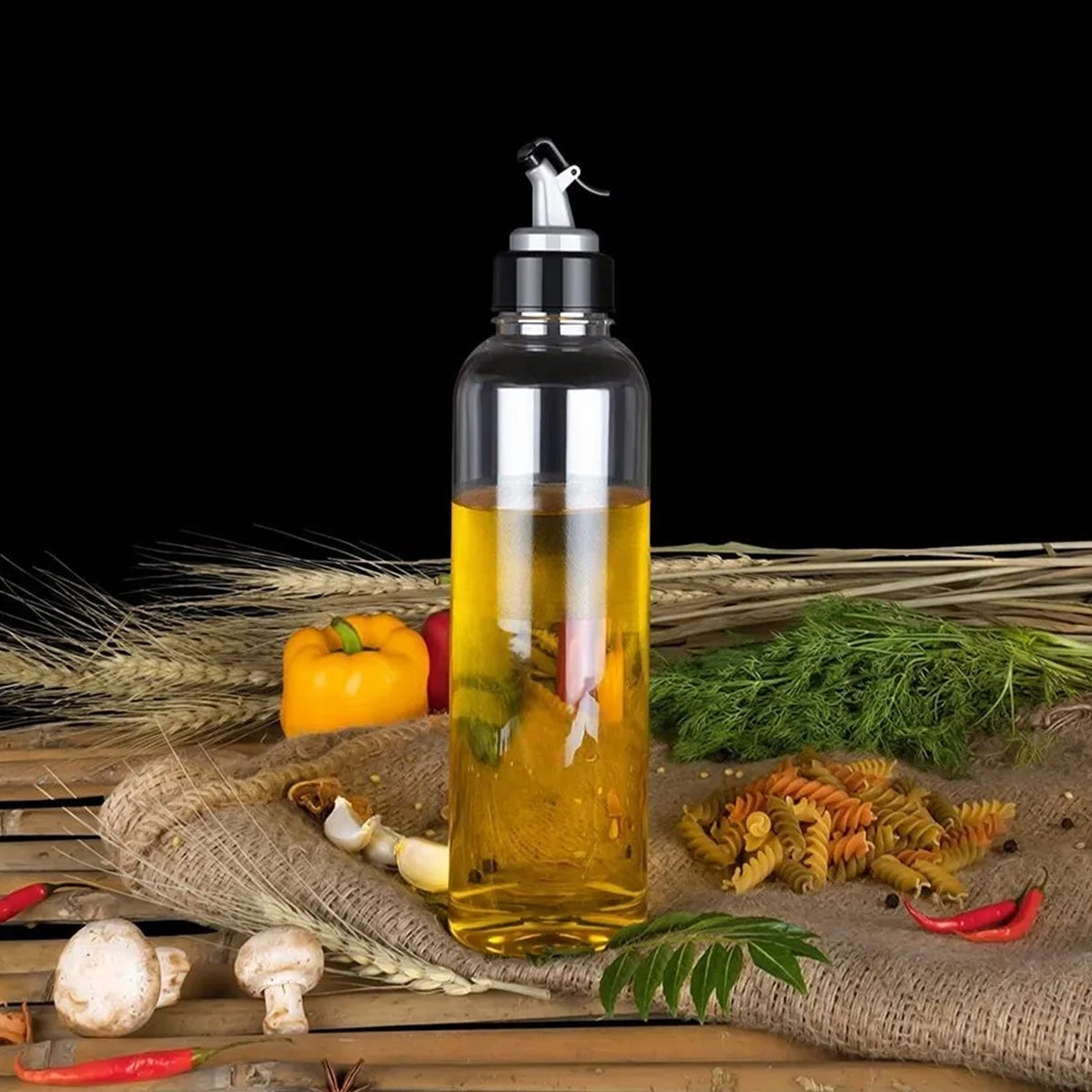 Clear plastic oil dispenser, 1 litre, with lid and drip-free spout. Main image