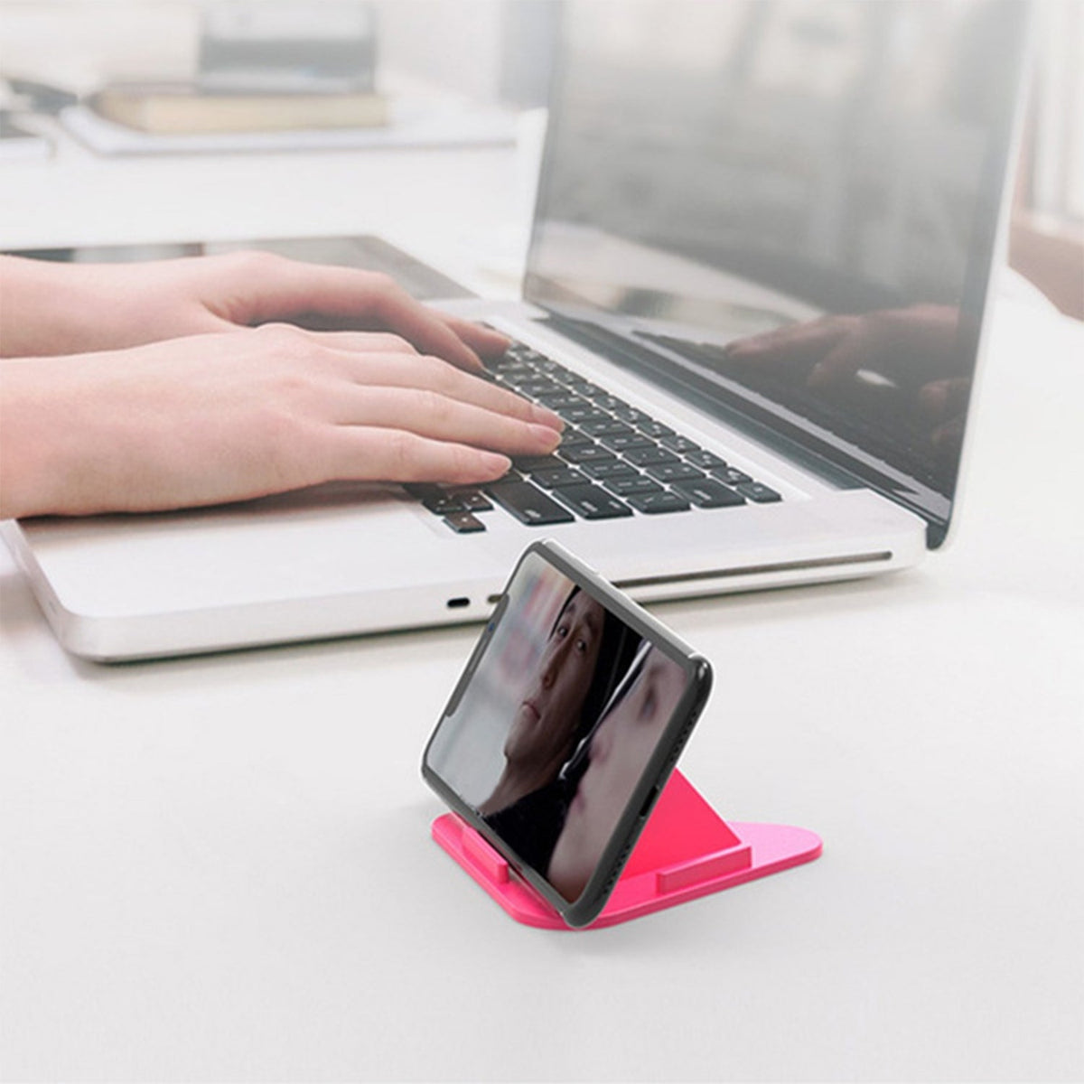Pyramid mobile stand in black, showcasing its compact design and multiple viewing angles. Main image