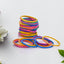 Multicolor rubber bands neatly arranged in a stack on a white surface.