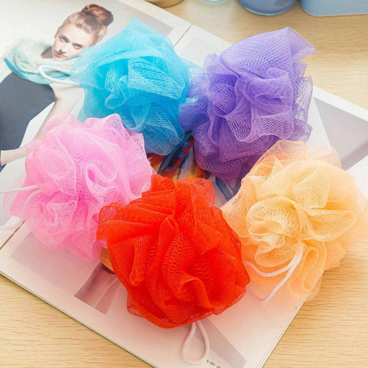 Set of 6 colorful bath loofah sponges, ideal for body scrubbing. Main image