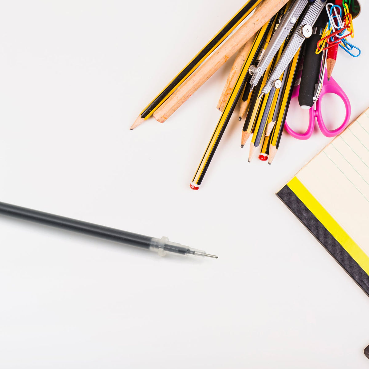A single black pen refill with a metal tip, ready for use. Main image