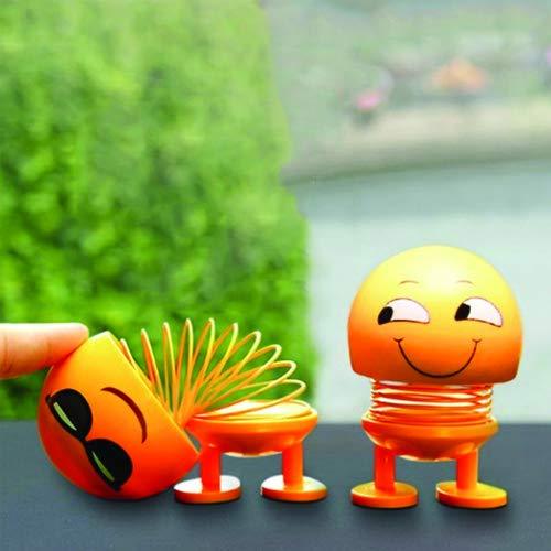 Close-up of a smiling emoticon shaking head doll with a spring neck, perfect for car dashboards. Main image