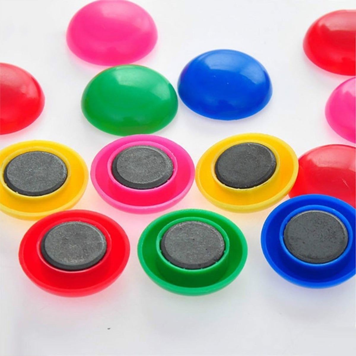 Close-up view of colorful circular board magnets, perfect for whiteboards. Main image