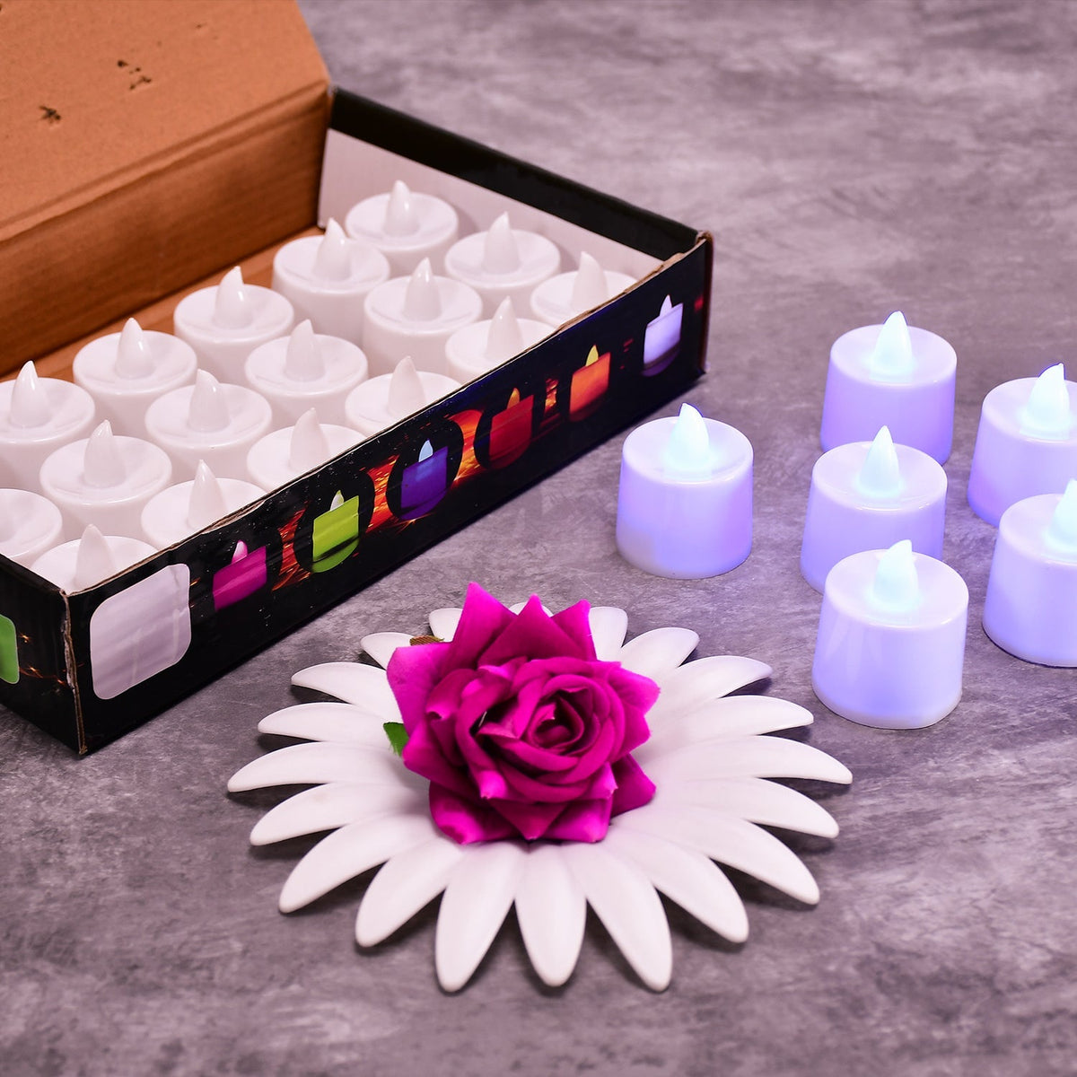 Pink flameless LED tealights glowing softly in a cluster. Main image