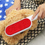 Double-sided pet hair remover brush with self-cleaning base for efficient fur removal.