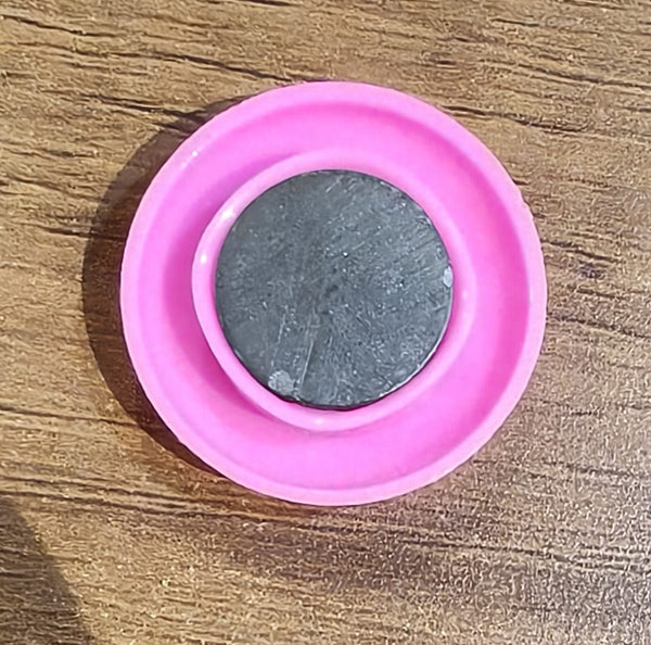 Multiple views of pink board magnet button showing size and colour