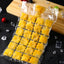Multiple self-sealing disposable ice cube bags being filled with water for freezing.