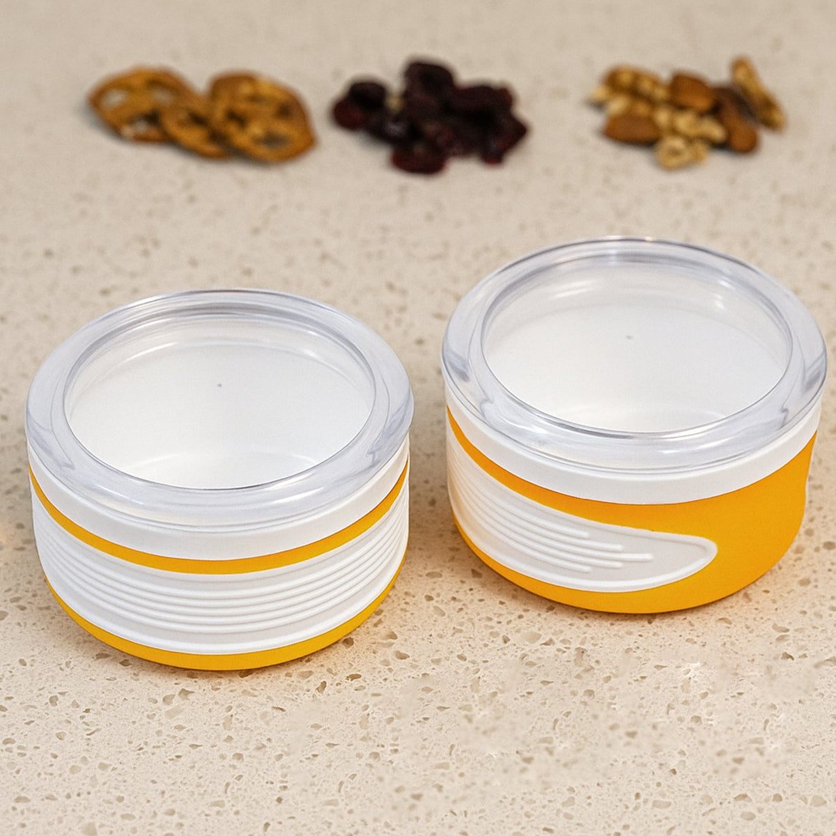 Two clear plastic airtight food containers with blue lids, stacked neatly. Main image
