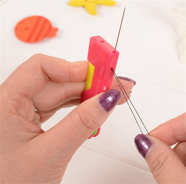 Multicolour automatic needle threading device showing a needle and thread ready for use. Main image