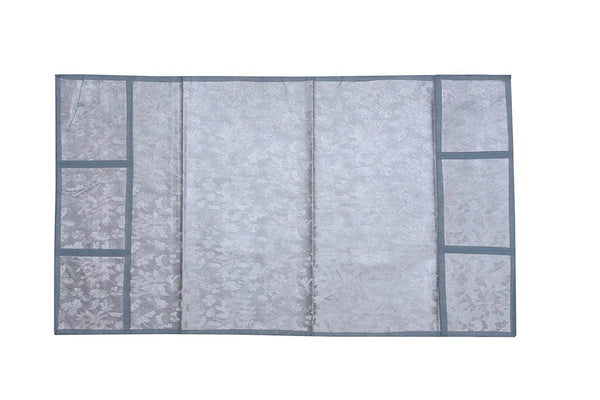 A Decorative Fridge Top Cover laid flat, highlighting its protective and aesthetic features.