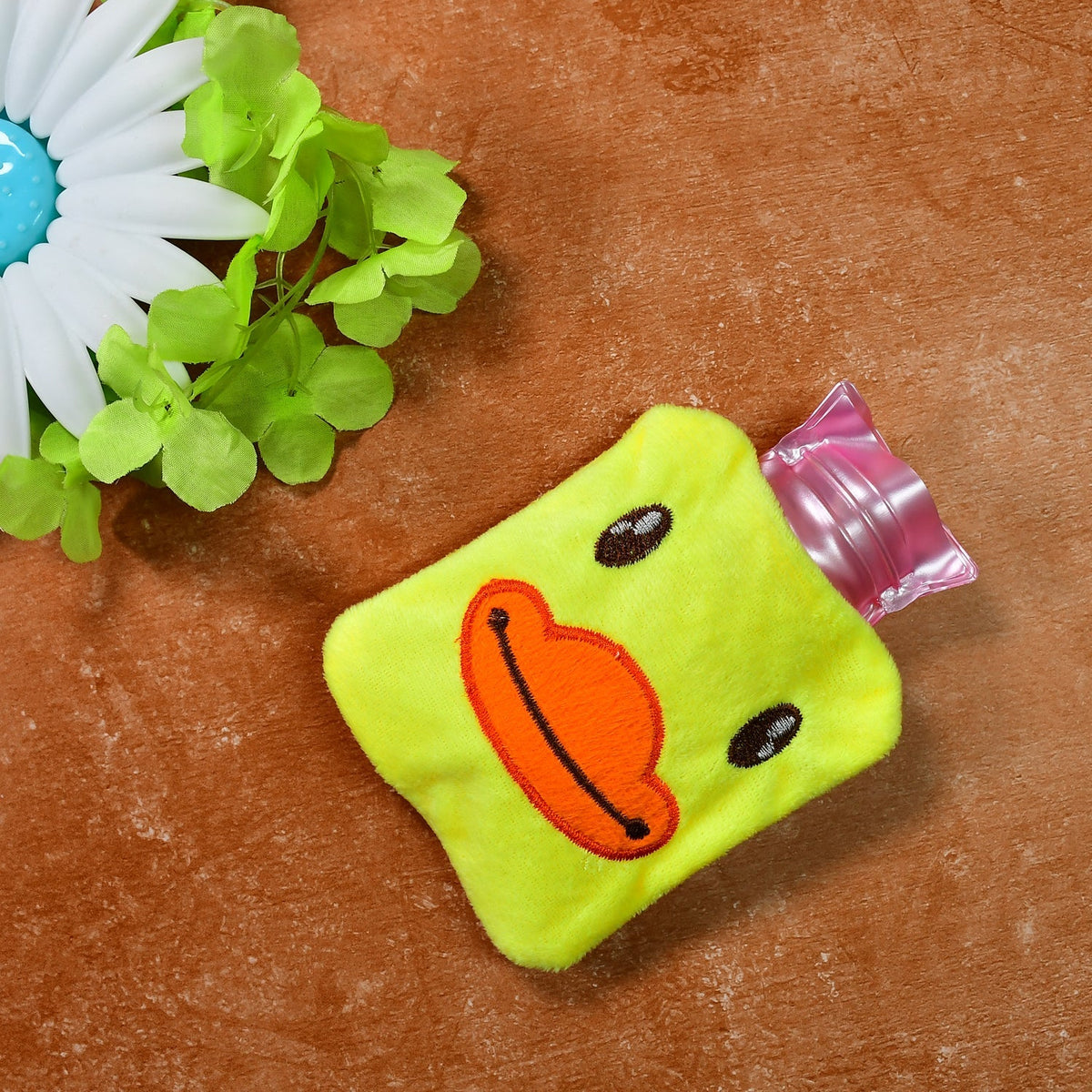 Yellow duck hot water bag with soft cover for pain relief. Main image
