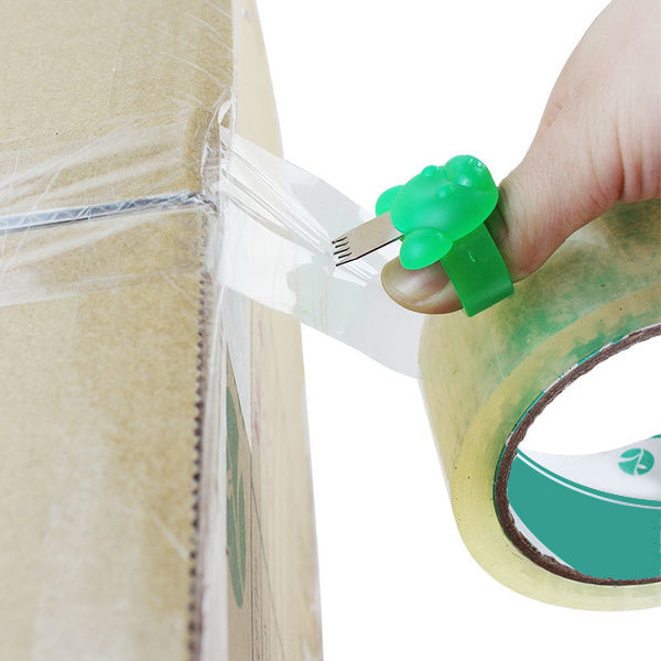 A person effortlessly cuts packing tape using the compact Finger Tape Cutter. Main image