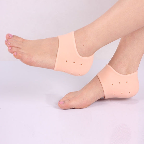 A pair of transparent silicone heel protectors for cracked heels. Main image
